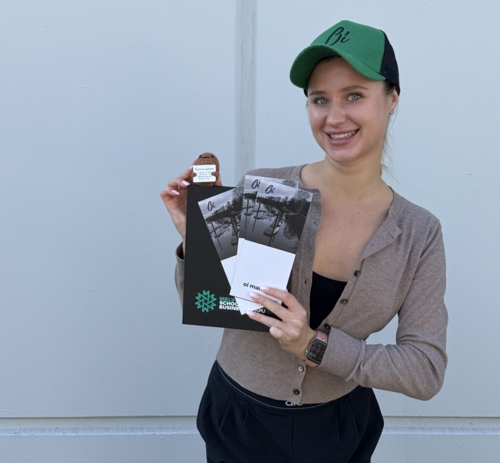 oi-marketing-marketing-coordinator-holding-pamphlets-and-t